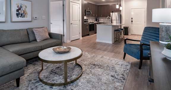 Staged modern living room in the Coastal model at Southern at Santa Rosa