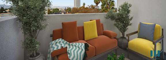 a living room with white walls and a green couch