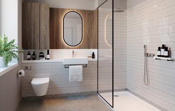 A modern bathroom with a walk-in shower and a toilet.