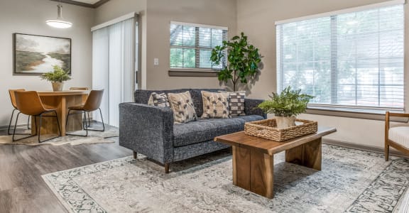 the living room of a home with a couch and a table