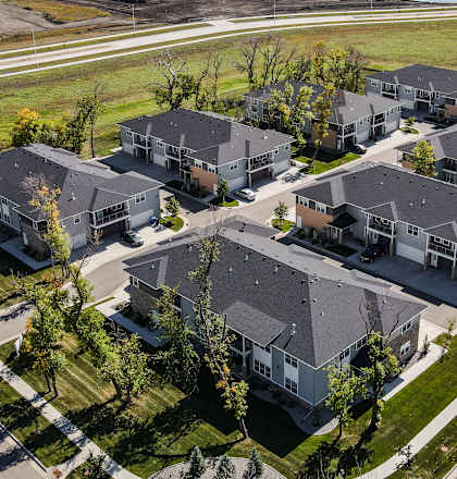A large group of houses are shown from an aerial view.