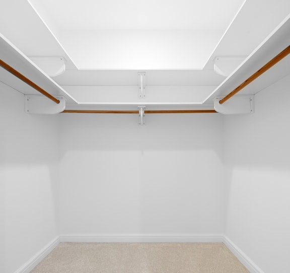 an empty room with white walls and a beige carpet at HIGHGROVE, Stamford, CT, 06901