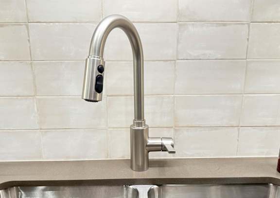a close up of a faucet in a kitchen sink