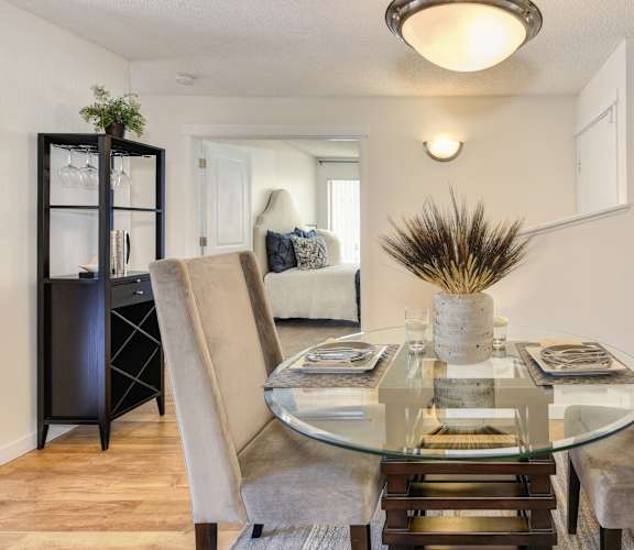 a dining room with a glass table and chairs at The Retreat at Walnut Creek, Walnut Creek, CA, 94596