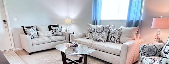 a living room with a couch and a table at Oakwood Apartments, Florence, KY, 41042