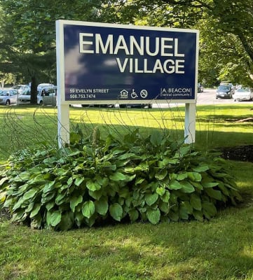 Sign Monument on Beautiful Landscaped Lawn Emanuel Village.