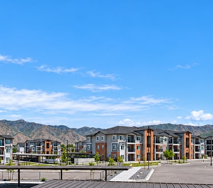 A parking lot with a mountain in the background.