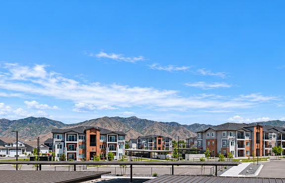 A parking lot with a mountain in the background.