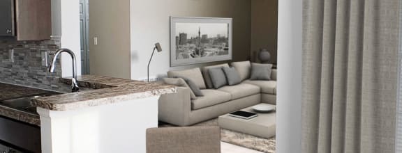 a living room with a couch and a table  at Steeplechase Apartments, Loveland, OH, 45140