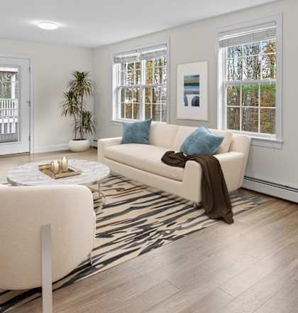 a living room with white walls and a white couch