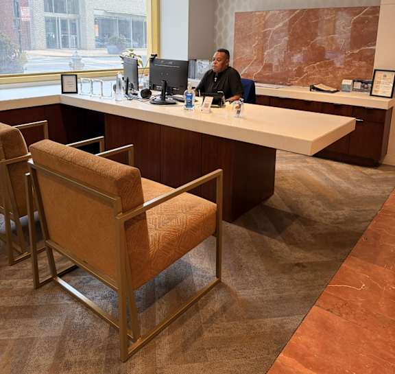 A man is sitting at a desk in an office.