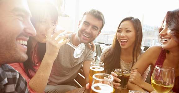 Group of Friends Drinking and Smiling