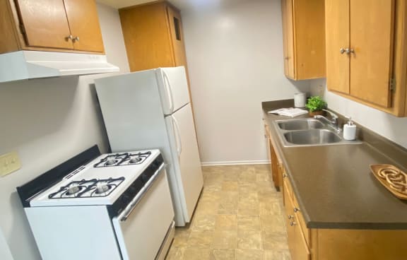 Small kitchen with two washes and a stove Kitchen with two washes and a stove top oven at Bowles Apts, Azusa, CA 91702