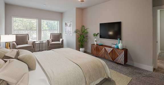 a bedroom with a large bed and a ceiling fan