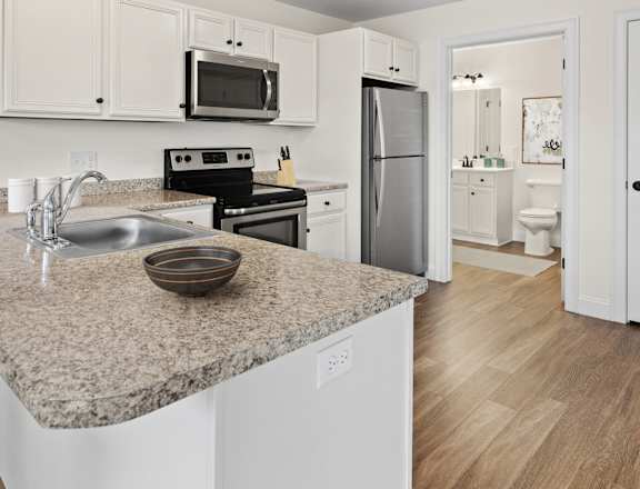 a kitchen with a granite counter top and a sink
