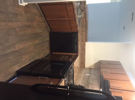 an overhead view of a kitchen with a stove and cabinets
