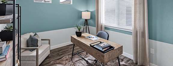 a living room with a kitchen and a table at Avilla Springs, Melissa, TX