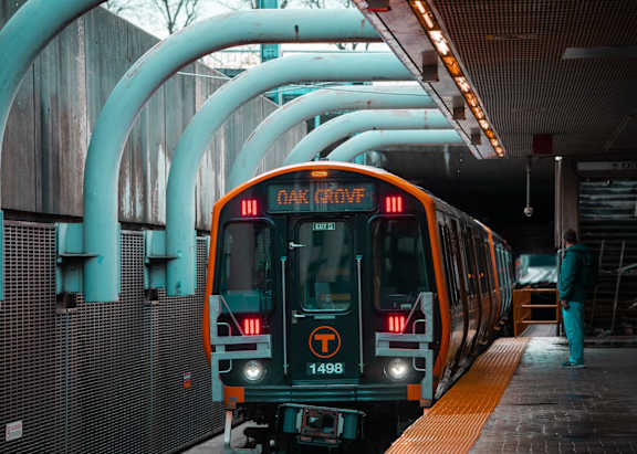 A train with the number 13 on the front is at the station.