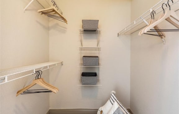 a walk in closet with racks and towels at Mirasol Apartments, Nevada, 89119