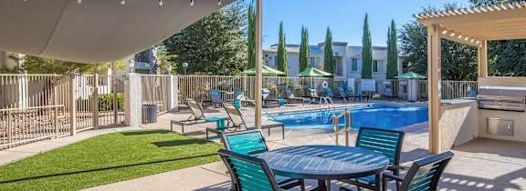 Port Royale Luxury Apartment Homes in Tucson, Arizona Patio and Pool with Lounge Chairs