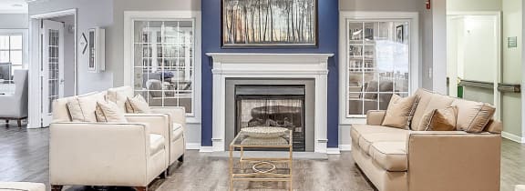 a large living room with couches and a fireplace at  Kendrick Court in Herndon
