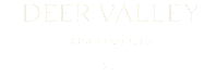 A black and white image with the words "Deer Valley Apartments" and a logo.