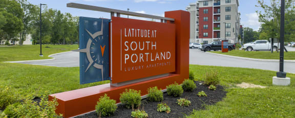 a sign in front of a building