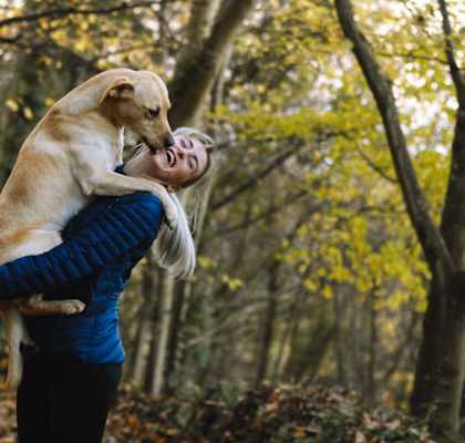 Woman and dogat Overton Park Apartments, Dallas, TX, 75216