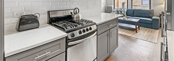a kitchen with a stove and a microwave