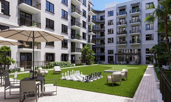 a rendering of an apartment building with a chess board in the middle of a grassy area at Leena Plantation, Plantation, 33322