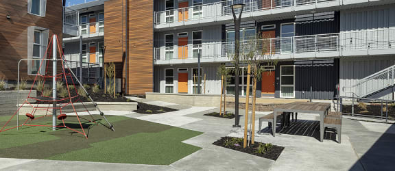 a view of the courtyard and balconies of an apartment complex