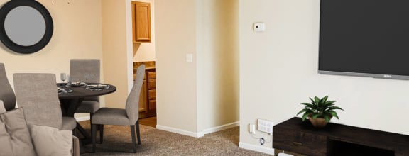 a living room with a couch and a table  at Crown Crossing Apartments, Amelia