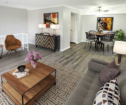 a living room with a couch a table and a chair