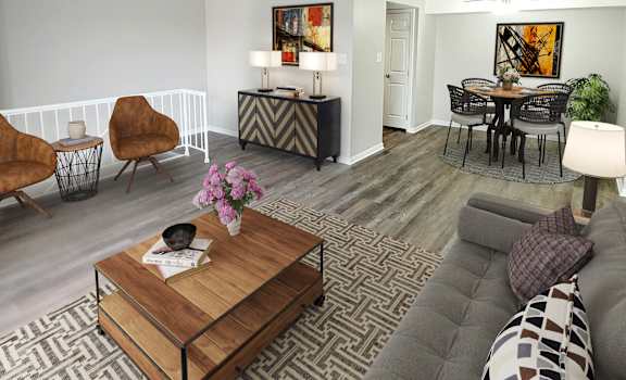 a living room with a couch a table and a chair