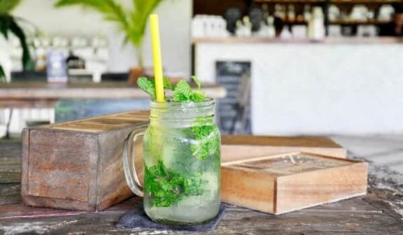 a cocktail in a on a wooden table