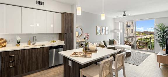 A modern kitchen with a dining table and chairs.
