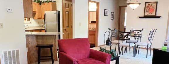 a living room with a couch and a table  at Walton Ridge Apartments, Walton, KY