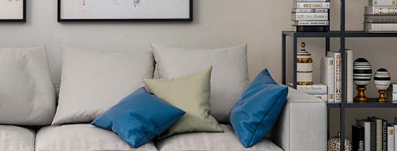 A modern living room with a white sofa, a coffee table, and two abstract paintings on the wall at Waterstone at Hamburg Apartments, Lexington