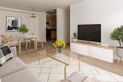a living room with a couch and a table and a television