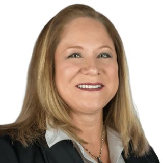 portrait of a woman with blonde hair and a suit