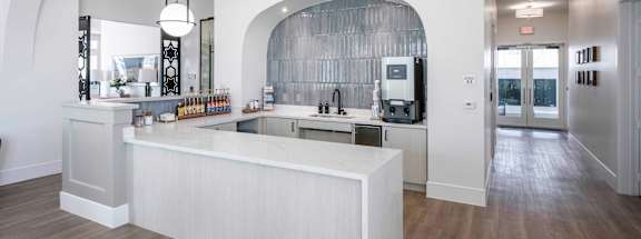 a kitchen with a large island in the middle of it