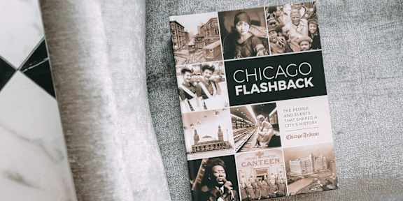 A book titled "Chicago Flashback" is placed on a black and white checkered surface.
