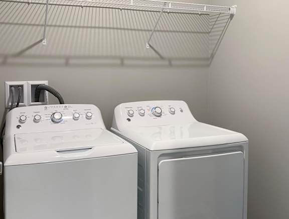 Washer and dryer closet with shelving space The Flats at Shadow Creek in Lincoln Nebraska