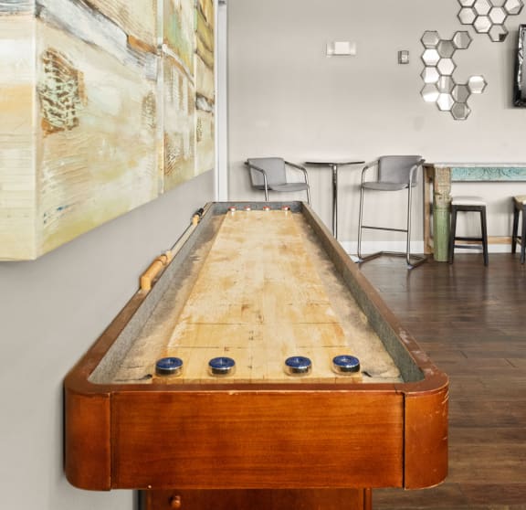 a pool table in a living room with a painting on the wall at The Ridge at Chenal Valley, Arkansas