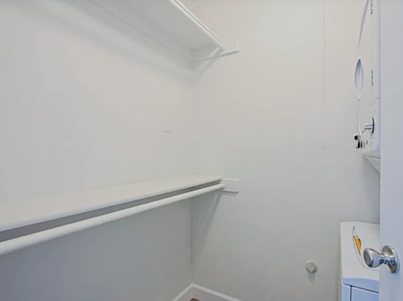 A white door with a silver handle is on the right side of the image.