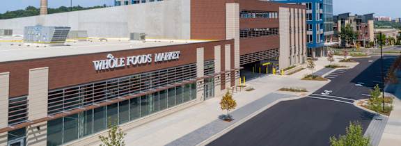 A Whole Foods Market is located in a modern building.