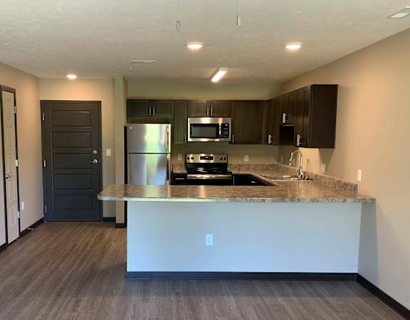 a view of a kitchen with a counter top and