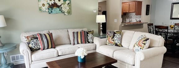 a living room with a couch and a table at Fox Run Apartments, Cincinnati
