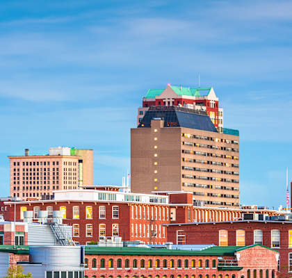 a view of the boston skyline from across the water