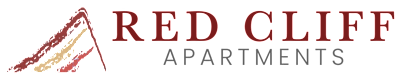 A graphic with the text "RED CLIFF" in red with a graphic of three vertical lines to the left of the text.